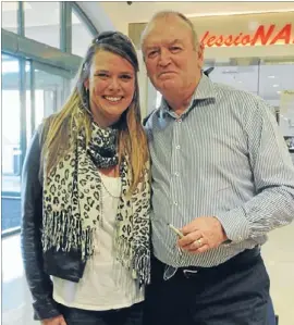  ?? Photo: ANDREA O’NEIL ?? Champion: Sir Graham Henry rubs shoulders with fan Emma Holland during a book-signing appearance at Paper Plus in Porirua last Wednesday.