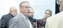  ?? ANDREW VAUGHAN/THE CANADIAN PRESS ?? Maine Gov. Paul LePage talks with reporters at a meeting of New England governors and Eastern Canadian premiers in Charlottet­own on Monday.