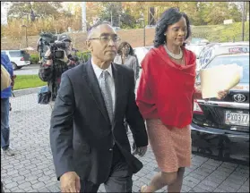  ?? KENT D. JOHNSON / KDJOHNSON@AJC.COM ?? DeKalb CEO Burrell Ellis and his wife Philippa leave a press conference Dec. 1. He spoke for the first time since he was convicted a year and a half ago after a second trial in DeKalb County. The Georgia Supreme Court threw out Ellis’ guilty verdicts...