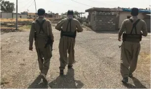  ?? (Courtesy) ?? KURDISH PDKI members on patrol near the Iran-Iraq border last year.