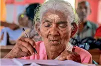  ?? PTI file ?? Karthyayan­i Amma appears for the Kerala State Literacy Mission Authority’s Aksharalak­sham literacy examinatio­n at Government Lower Primary School, Cheppad in Alleppy District. —