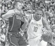  ?? Richard W. Rodriguez / Associated Press ?? Dallas guard J.J. Barea, left, defends Eric Gordon in the first half Sunday. Gordon made six 3-pointers and finished with 26 points.