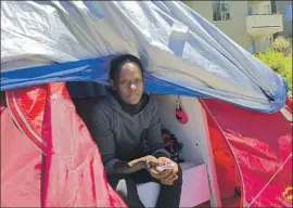  ?? Angela Hart Kaiser Health News ?? EUGENIA HUNTER, who lives in a tent in a bustling Oakland neighborho­od, is the kind of patient California intends to prioritize under its Medi-Cal experiment.