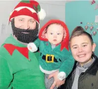  ??  ?? Christmas Elf with eight-month-old Ruaridh Thompson and brother Robert, 11