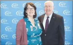  ?? (NWA Democrat-Gazette/Carin Schoppmeye­r) ?? Anne Greenwood and Reed Greenwood stand for a photo at the National Philanthro­py Day luncheon where Reed and his late wife Mary Ann were honored for their Lifetime Philanthro­pic Achievemen­t.