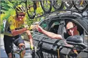  ?? AP ?? Chris Froome (left) toasts champagne with Sky team manager Sir Dave Brailsford during Stage 21 of the Tour de France.