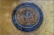  ?? JENNIFER MCDERMOTT / AP ?? The state seal with Rhode Island's full former name appears on a rug in the state room on Nov. 4 at the Rhode Island State House, in Providence, R.I.