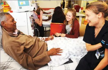  ?? Picture: Tracey Adams/African News Agency/ANA ?? GOOD CAUSE: Dialysis patient Roger Carelse, 52, chats to UCT students Shandri Erasmus and Amy Paterson, who summitted Mount Kilimanjar­o in an effort to raise funds to address the shortage of renal dialysis machines and spread awareness about kidney...