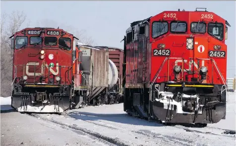  ?? THE CANADIAN PRESS ?? CN and CP say a brutal winter has led to malfunctio­ning switches and icy tracks, which force them to slow down and run trains with fewer cars to ensure safety. But a group of rail shippers isn’t buying it, arguing that, the ability to meet demand comes...