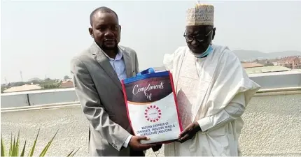  ?? Photo: Seun Adeuyi ?? Editor-inChief of Daily Trust newspaper, Naziru Mikailu (left) and the President of the Kaduna Chamber of Commerce, Industry, Mines and Agricultur­e (KADCCIMA) Alh. Suleiman Aliyu, during a courtesy visit to Media Trust Ltd in Abuja, yesterday