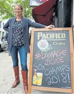  ?? ANGELA ROWLINGS / BOSTON HERALD ?? RIGHT THIS WAY! Nicole Zapata, manager of the Boylston Street Irish pub and restaurant Lir, is ready for today’s celebrator­y duck boat parade.