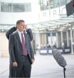 ?? REUTERS ?? British Chancellor of the Exchequer Jeremy Hunt talks to a TV crew outside the BBC headquarte­rs in London, Britain on Nov 18.