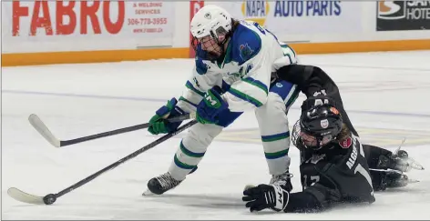  ?? STEVEN MAH/SOUTHWEST BOOSTER ?? Jace Egland (left) got behind the Battleford­s Stars to draw a penalty on Kash Alger-east during a 7-5 win on Dec. 16.