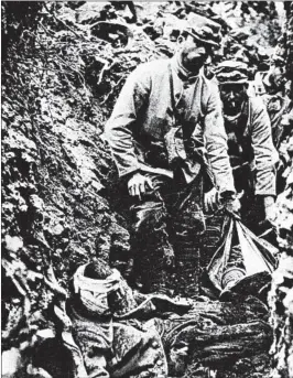  ?? GETTY-AFP ?? French soldiers care for wounded comrades in a trench during World War I, in which 40 million soldiers and civilians died, making it one of the deadliest conflicts in history.