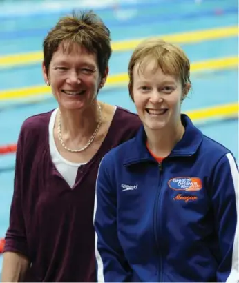  ?? F. SCOTT GRANT/SWIMMING CANADA ?? Own The Podium boss Anne Merklinger, left, says daughter Meagan Michie is “comfortabl­e in her own skin.”