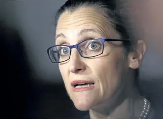  ?? FRED CHARTRAND/THE CANADIAN PRESS ?? Foreign Minister Chrystia Freeland talks to reporters outside the House of Commons on Parliament Hill, in Ottawa. Freeland says the world wants Canada to trumpet tolerance and diversity.