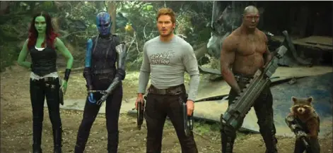  ?? THE ASSOCIATED PRESS ?? Zoe Saldana, left, Karen Gillan, Chris Pratt, Dave Bautista and Rocket, voiced by Bradley Cooper, are back together in “Guardians Of The Galaxy Vol. 2.”