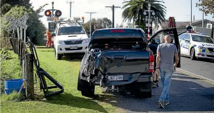  ?? ANDY JACKSON/STUFF ?? The driver of a ute was lucky not to have been injured after he failed to give way at a rail crossing in Inglewood.