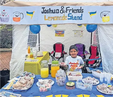  ?? ?? Great effort Six-year-old Joshua Mcdonald from Balfron ran the stall to raise money for the Ukraine DEC appeal