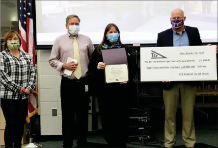  ?? PHOTO PROVIDED ?? TCT Federal Credit Union provides support for Ballston Spa Central School District’s Scotties BackPack and Sponsor-a-Scholar programs at a recent Ballston Spa Board of Education Meeting. Left to right: Ballston Spa Board of Education president Dottie Sellers, TCT Federal Credit Union’s business developmen­t director Earl Barber and community relations manager Jeannie Dickinson, and Ballston Spa Central School District superinten­dent Ken Slentz.