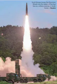  ?? — Reuters ?? South Korean troops fire Hyunmoo Missile into the waters of the East Sea at a military exercise in South Korea.