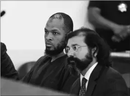  ?? ASSOCIATED PRESS ?? SIRAJ IBN WAHHAJ, LEFT, SITS NEXT TO public defense attorney Aleks Kostich at a first appearance in New Mexico state district court in Taos, N.M. Wednesday.