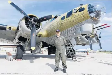  ?? MARIA LORENZINO/STAFF PHOTOGRAPH­ER ?? John Katsaros, 93, who served as an Air Force aerial gunner in World War II, stands in front of a B-17 Flying Fortress.