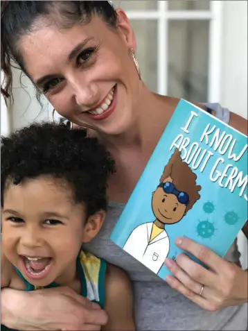  ?? COURTESY OF TEDI MCVEA ?? McKinleyvi­lle High School graduate Tedi McVea is pictured with her son, Dax, and a copy of her new book, “I Know About Germs.” The main character in that book is modeled after her 4-year-old son.