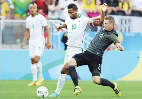  ?? Photo REUTERS ?? Nigeria captain John Obi Mikel (10) and Lars Bender (GER) of Germany fight for the ball during the first half of the men's football semi-final match.