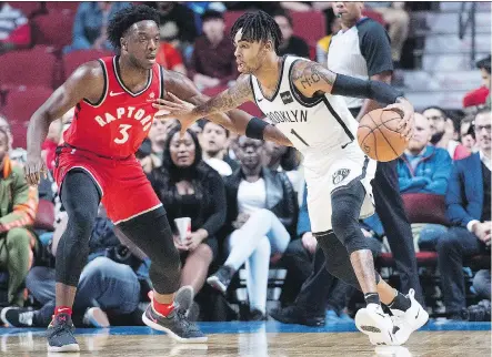  ?? GRAHAM HUGHES/THE CANADIAN PRESS ?? Toronto’s OG Anunoby defends Brooklyn’s D’Angelo Russell during an NBA Canada Series pre-season game Wednesday night at Montreal’s Bell Centre, where the Raptors scored a 118-91 victory over the Nets in front of the team’s enthusiast­ic Quebec fans.