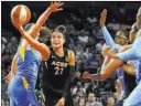  ?? Chase Stevens ?? Las Vegas Review-journal Aces guard Kayla Mcbride (21) slices inside for a shot against the Chicago Sky. She is averaging 18.9 points.