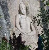  ?? — AFP ?? The seventh- century rock sculpture of a seated Buddha carved into a mountain in Jahanabad town in the northweste­rn Swat Valley of Pakistan.