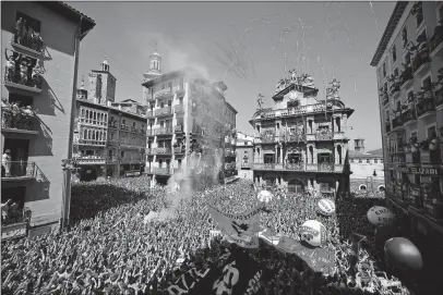  ?? [ALVARO BARRIENTOS/THE ASSOCIATED PRESS] ?? A blast of fireworks officially opens the 2019 San Fermin Fiestas in Pamplona, Spain, on Saturday. The festival, which runs through July 14, includes days of parties, dancing, music and food, but probably is best known for the Running of the Bulls.