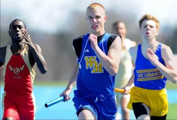  ?? Pam Panchak/Post-Gazette ?? West Mifflin’s Kevin Garbark heads to the finish line on the winning 1,600-meter relay at the annual Tri-Sate Track Coaches Associatio­n Invitation­al April 11 at West Mifflin. Garbark is one of the top sprinters in the WPIAL.