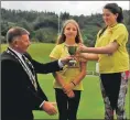  ??  ?? Councillor Roddy McCuish presents the trophy to Charlie Johnstone, with Ishbel Mackay second.