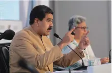  ??  ?? Venezuela’s President Nicolas Maduro (L) speaks next to National Electoral Council (CNE) President Tibisay Lucena