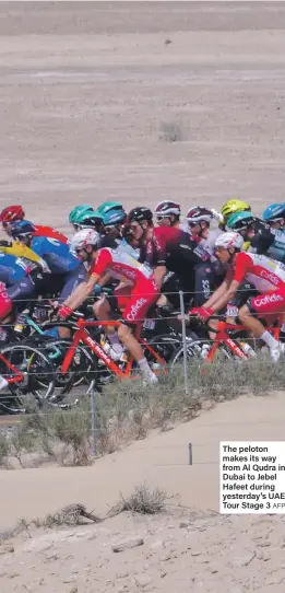  ?? AFP ?? The peloton makes its way from Al Qudra in Dubai to Jebel Hafeet during yesterday’s UAE Tour Stage 3