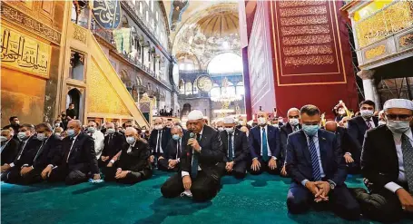  ?? FOTO ČTK/AP ?? Turkey's President Recep Tayyip Erdogan recites from the Quran during Friday prayers in Hagia Sophia, Istanbul.