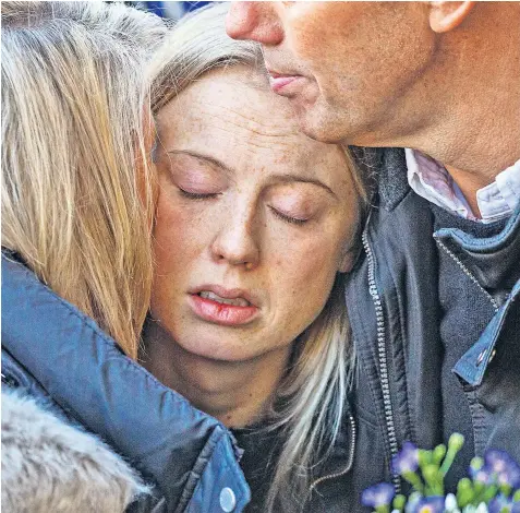  ?? Reports: Pages 4-5 ?? The girlfriend of 25-year-old Jack Merritt, who was stabbed to death in the London Bridge terror attack, was among mourners taking part in a vigil and one-minute silence in Cambridge yesterday. Leanne O’brien, a veterinary science student, held a teddy bear as she stood with Jack’s parents in front of the Guildhall.