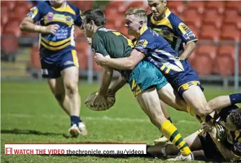  ?? PHOTO: NEV MADSEN ?? MAN OF THE MOMENT: Wattles halfback Matt Duggan tries to get a pass away before being wrapped up by the Highfields defence in the TRL eliminatio­n semi-final at Clive Berghofer Stadium on Saturday night.
