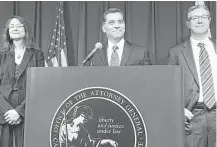  ?? Don Thompson / Associated Press ?? California Attorney General Xavier Becerra, center, along with two deputy attorneys general, announces the BP settlement Thursday.