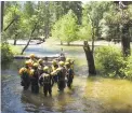  ?? SCOTT SMITH/AP PHOTO ?? The water rescue team at Yosemite National Park, Calif., perform training May 25 in the frigid and swift water of the Merced River.