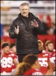  ?? Associated Press ?? PAY CUT — In this 2019 file photo, Utah head coach Kyle Whittingha­m looks on before the start of their NCAA college football game against Colorado in Salt Lake City.