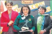  ??  ?? Principal Vibha Singh, DPS, Rohini felicitati­ng a student.