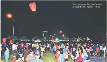  ??  ?? Thousands throng Sibu Town Square to celebrate the Mid-Autumn Festival.