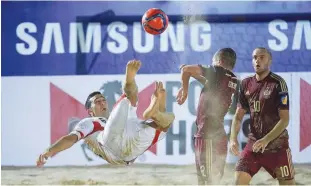  ??  ?? Action in the semi-final of the 2015 Interconti­nental Beach Soccer Cup between Iran and Russia in Dubai.