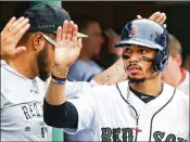  ?? ADAM GLANZMAN / GETTY IMAGES ?? Mookie Betts of the Boston Red Sox has raised his game to another level, leading the league in most offensive categories.