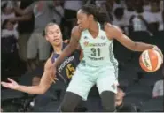  ?? MARY ALTAFFER - THE ASSOCIATED PRESS ?? New York Liberty center Tina Charles (31) drives to the basket against Connecticu­t Sun forward Alyssa Thomas (25) during the first half of a WNBA basketball game, on Wednesday, at Madison Square Garden in New York. The Liberty won 96-80.