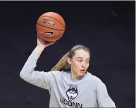  ?? Jessica Hill / Associated Press ?? UConn star Paige Bueckers says she is focused on basketball and not any NIL opportunit­ies that have come her way.