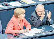  ?? ?? Schäuble in 2015 with Angela Merkel: earlier he led German reunificat­ion talks